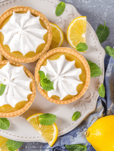 Overhead image of Mini Lemon Tarts on a white plate