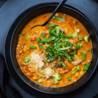 Overhead image of Pizza Soup in a black bowl