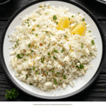 Close up overhead image of Greek rice on a white plate - 8