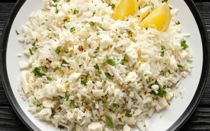 Close up overhead image of Greek rice on a white plate