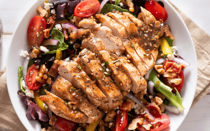 Overhead image of Honey Balsamic Chicken over a fresh salad