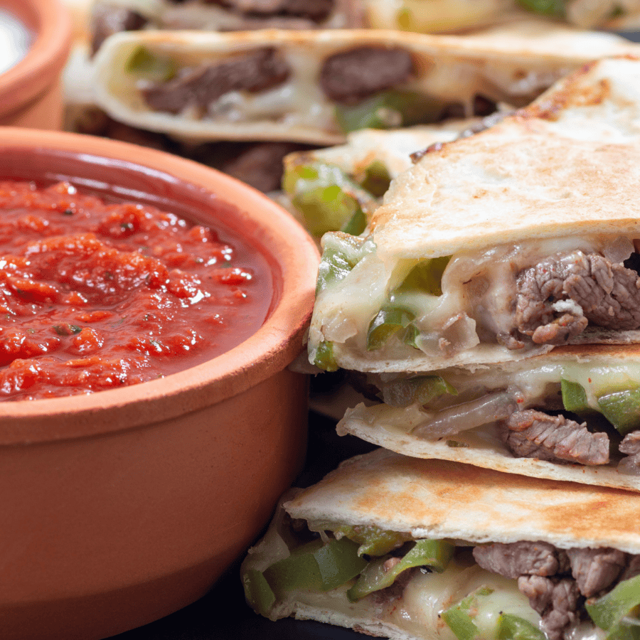 Close up image of a steak quesadilla with salsa
