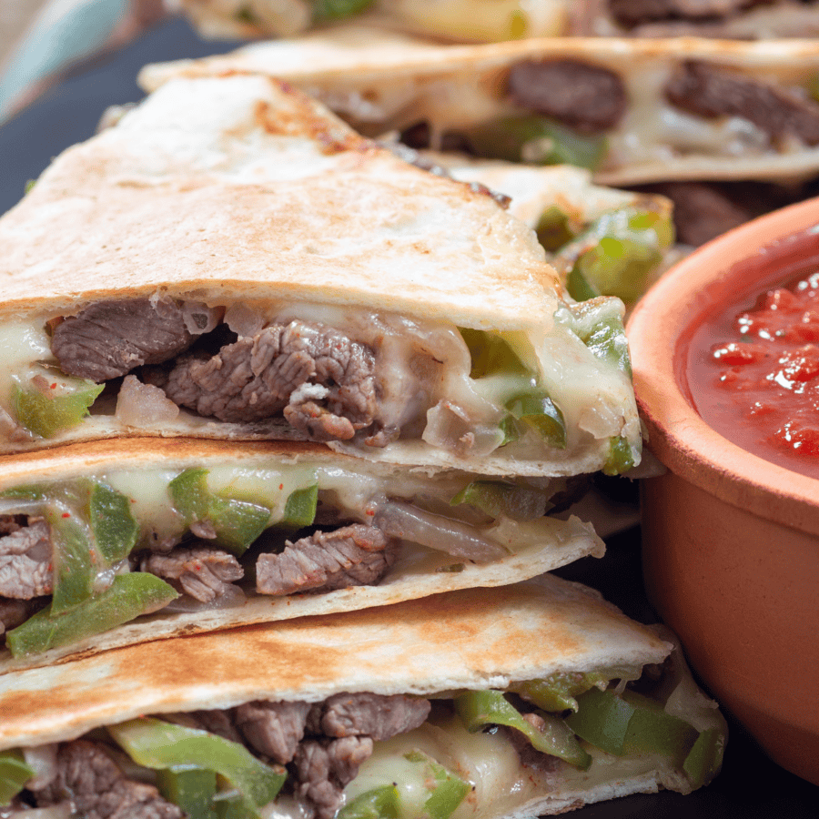 Steak Quesadillas with a bowl of salsa