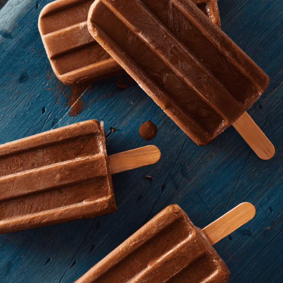 Multiple fudgesicles on a blue background