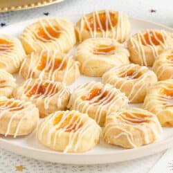 Kolaches on a white plate on a light surface