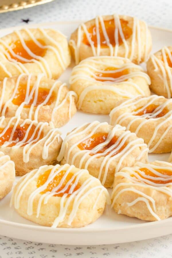 Kolaches on a white plate on a light surface