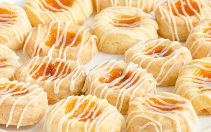 Kolaches on a white plate on a light surface