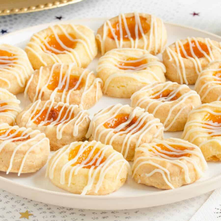 Kolaches on a white plate on a light surface