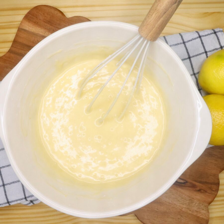 Lemon Brownie batter in a mixing bowl with a whisk 