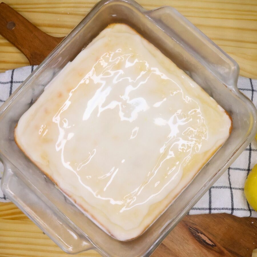 Glazed Lemon Brownies in a glass pan
