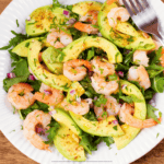 Overhead image of a shrimp salad on a white plate - 8
