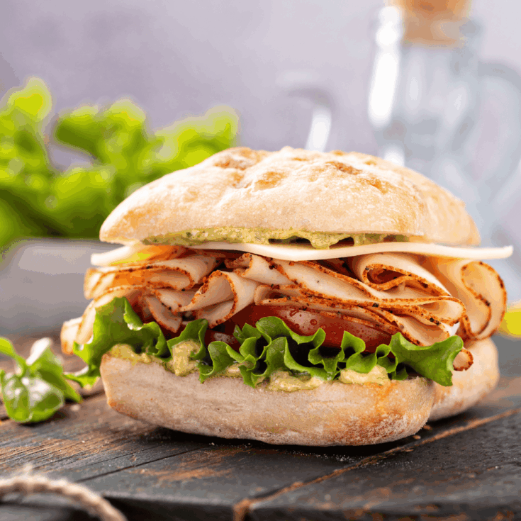 Turkey Pesto Sandwich on a wooden table