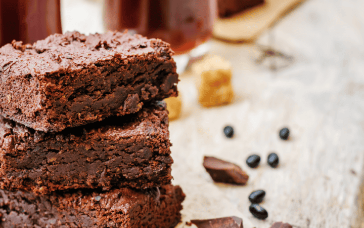 A stack of black bean brownies on parchment paper