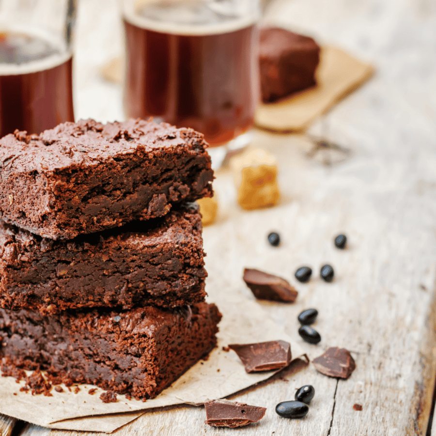 A stack of black bean brownies on parchment paper