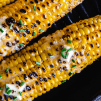 Close up image of Cajun corn on the cob