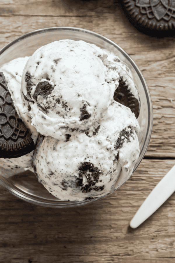 Overhead image of cookies and cream ice cream in a glass bowl