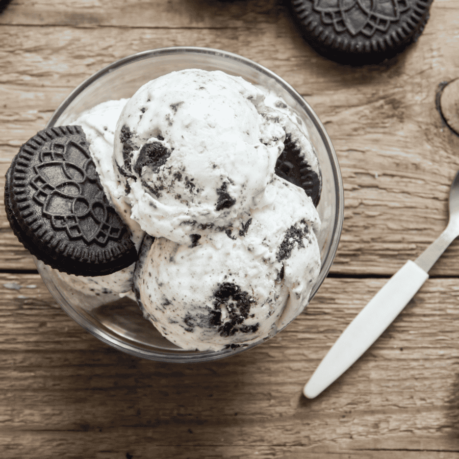 Overhead image of cookies and cream ice cream in a glass bowl