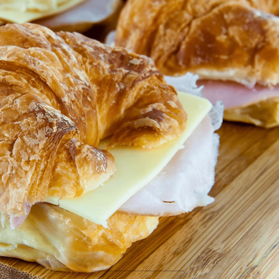 Close up image of a ham and cheese croissant
