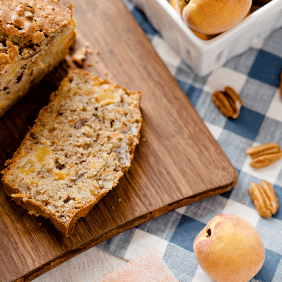 Close up image of Peach Bread on a wooden cutting board