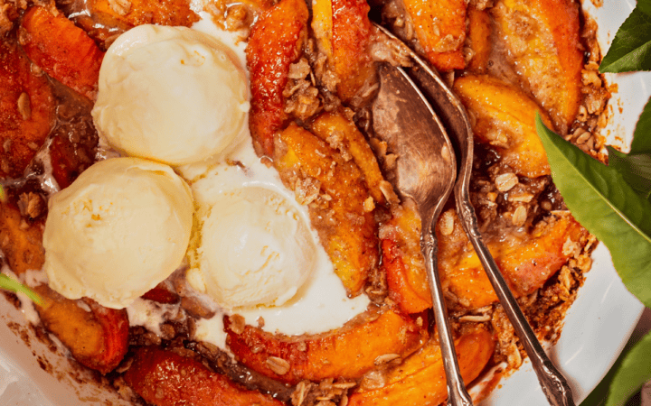 Overhead image of Peach Crisp with scoops of vanilla ice cream