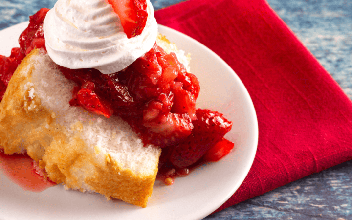 Close up image of strawberry angel food cake on a plate