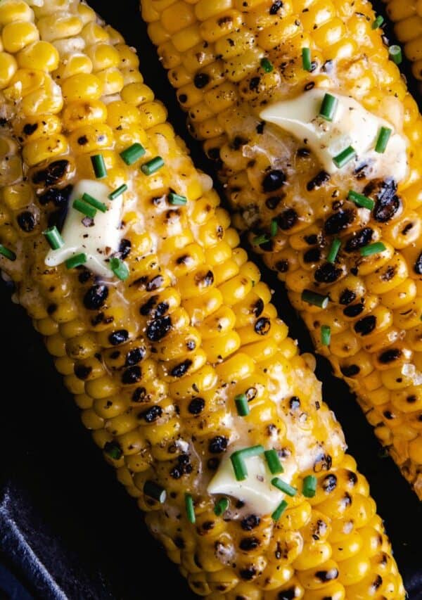 Overhead image of Cajun Corn on the Cob in a cast iron skillet