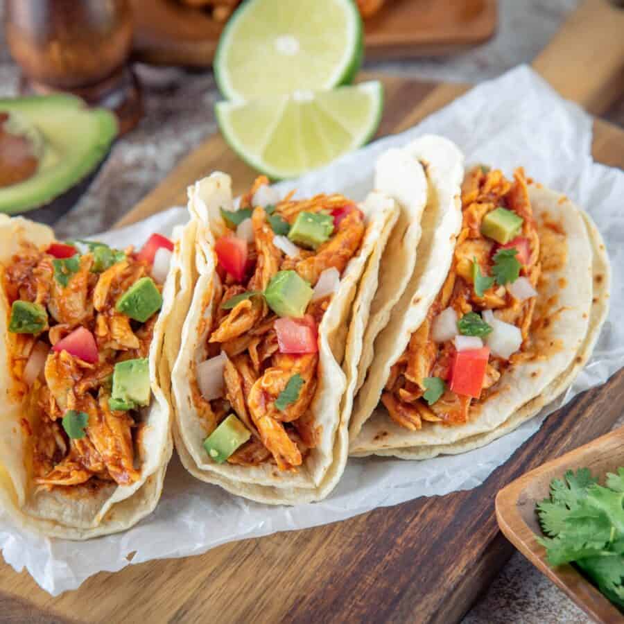 Three Chicken Street Tacos on parchment paper