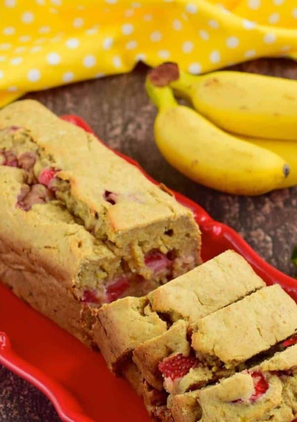 Strawberry Banana Bread sliced on a red platter