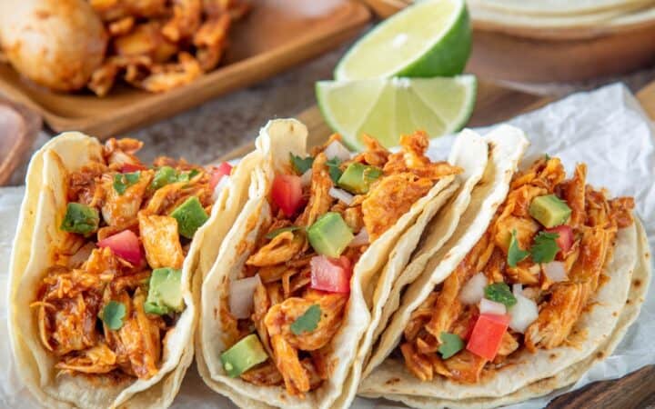 Overhead image of Chicken Street Tacos on a wooden cutting board