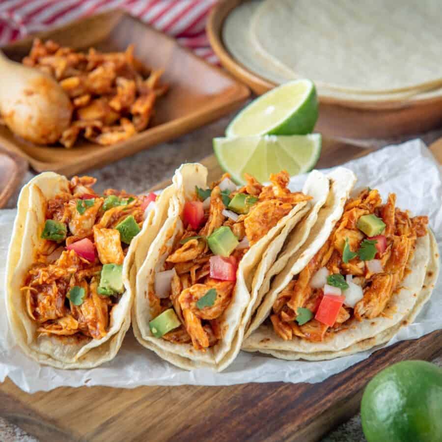 Overhead image of Chicken Street Tacos on a wooden cutting board