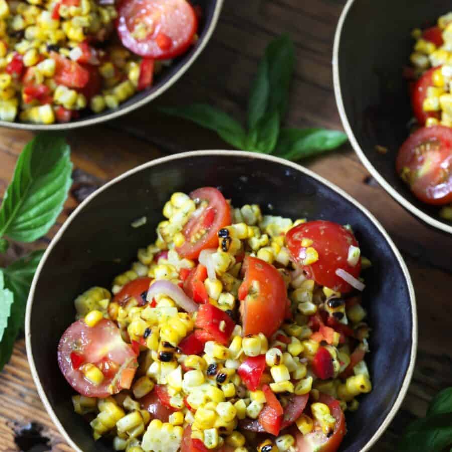 Three bowls of Corn and Tomato Salad