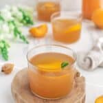 Glasses of Peach Lemonade on a decorative wooden plank - 7