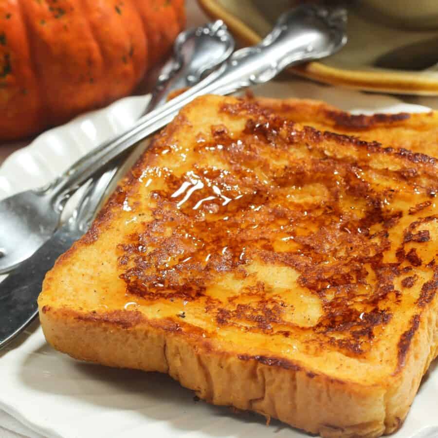 Pumpkin French Toast on a white plate with cutlery