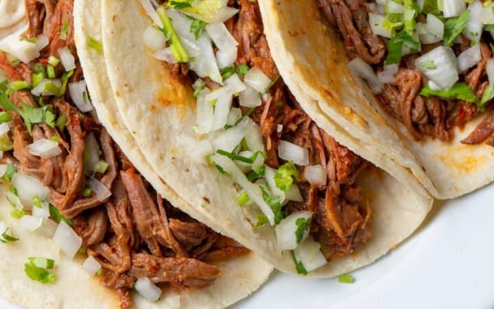 Slow Cooker Barbacoa on three tortillas