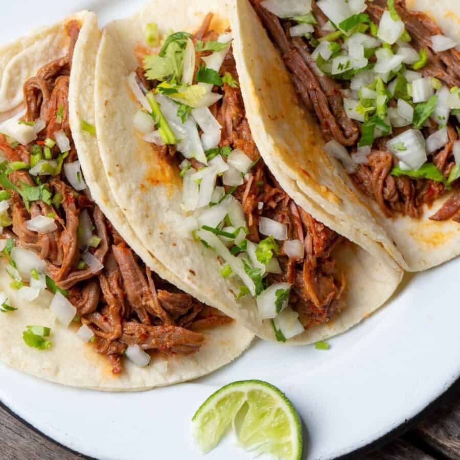 Slow Cooker Barbacoa on three tortillas