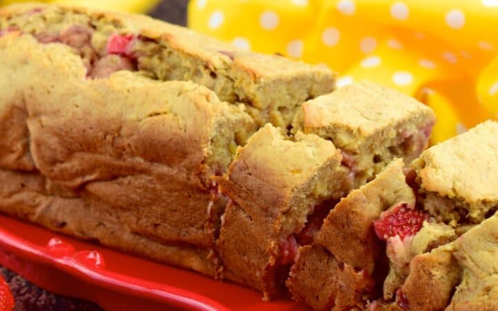 Close up image of Strawberry Banana Bread on a red serving tray