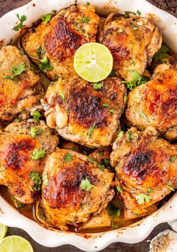 Overhead image of Baked Honey Lime Chicken thighs in a white baking dish