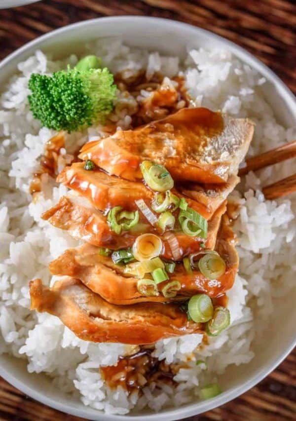 Overhead image of Slow Cooker Chicken Teriyaki in a white bowl with cooked rice