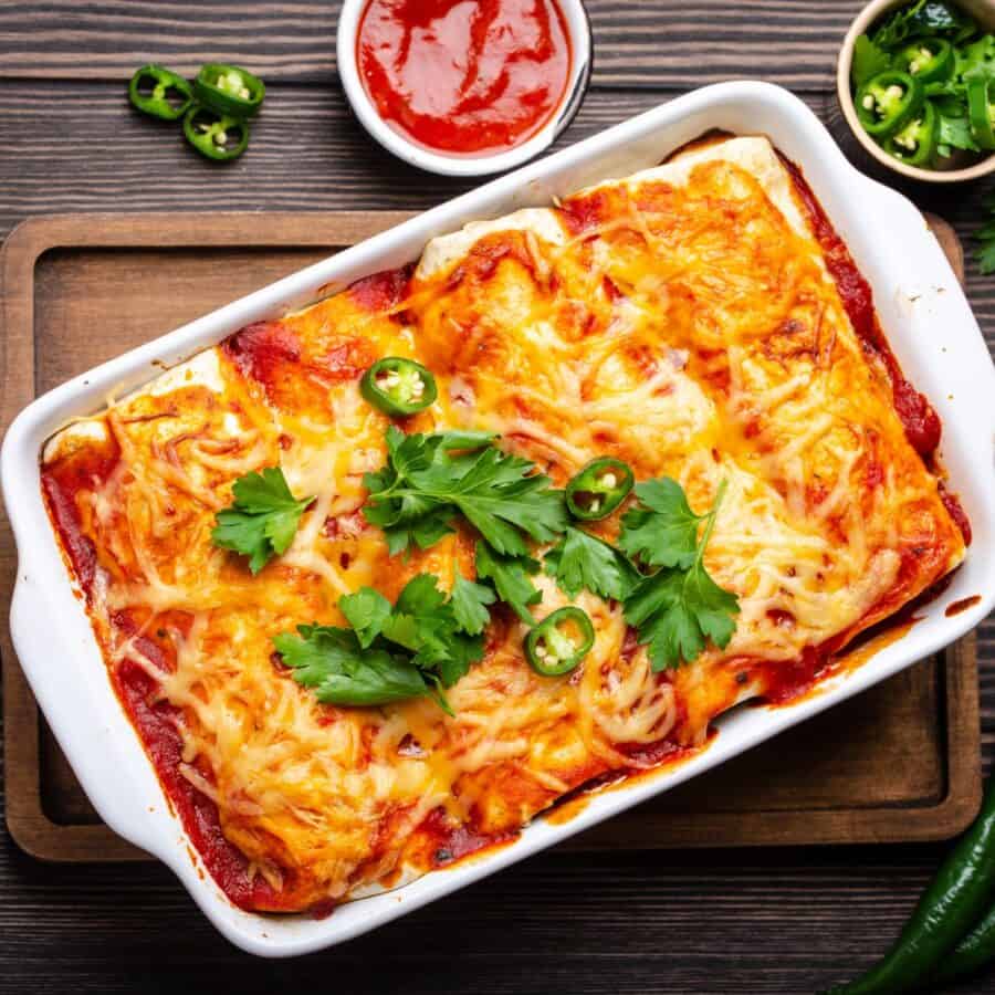 Overhead image of Beef and Been Enchiladas in a white baking dish