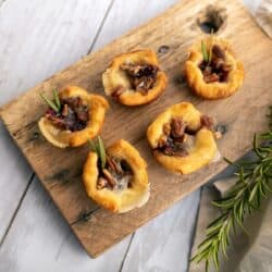 Overhead image of Cranberry Brie Bites on a wooden cutting board