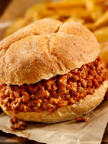 Close up image of Crock Pot Sloppy Joes on parchment paper