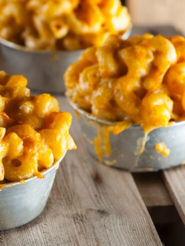 Close up image of bowls of pumpkin mac and cheese