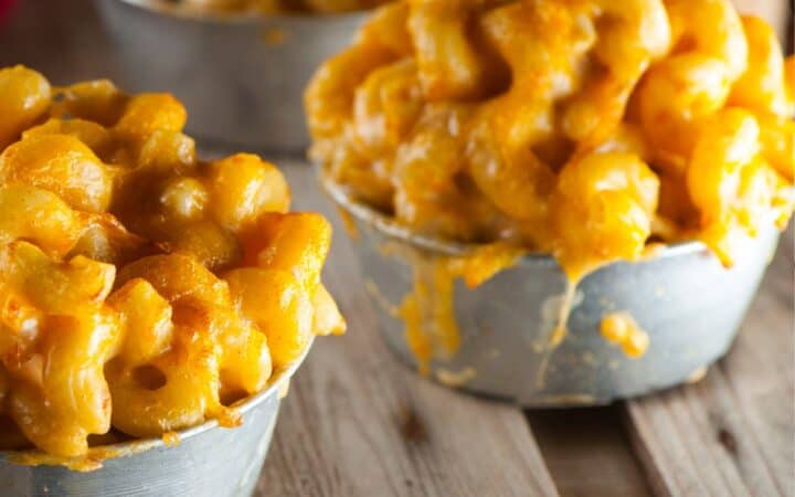 Close up image of bowls of pumpkin mac and cheese