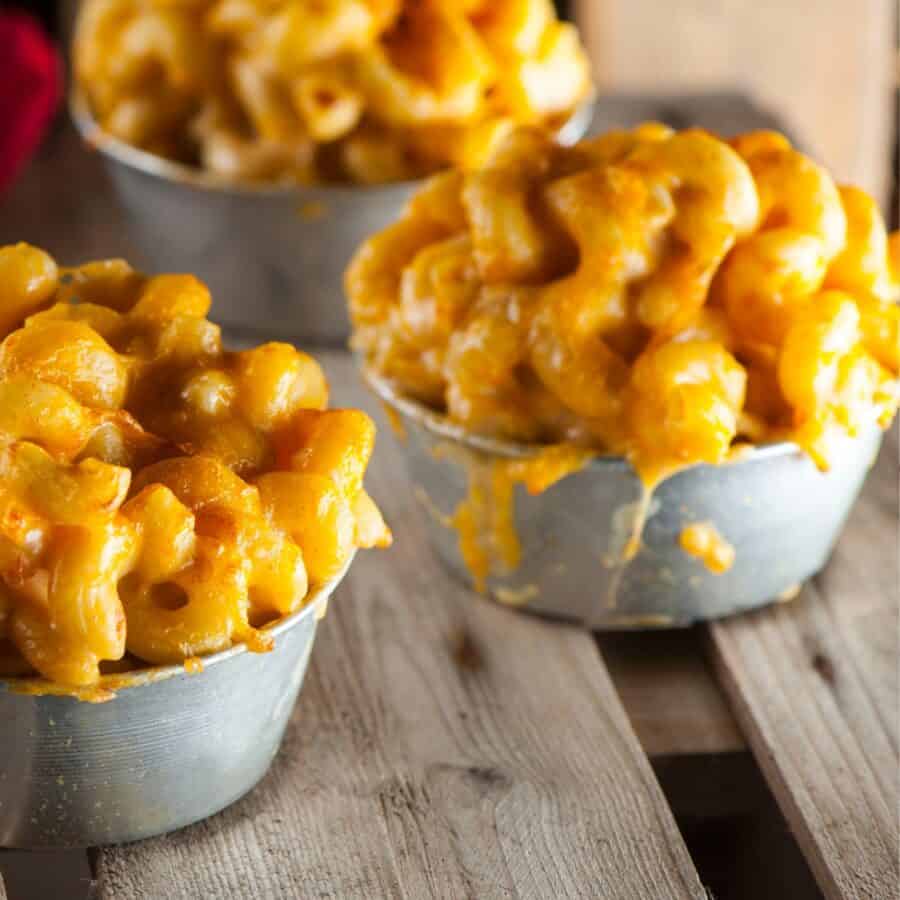 Close up image of bowls of pumpkin mac and cheese