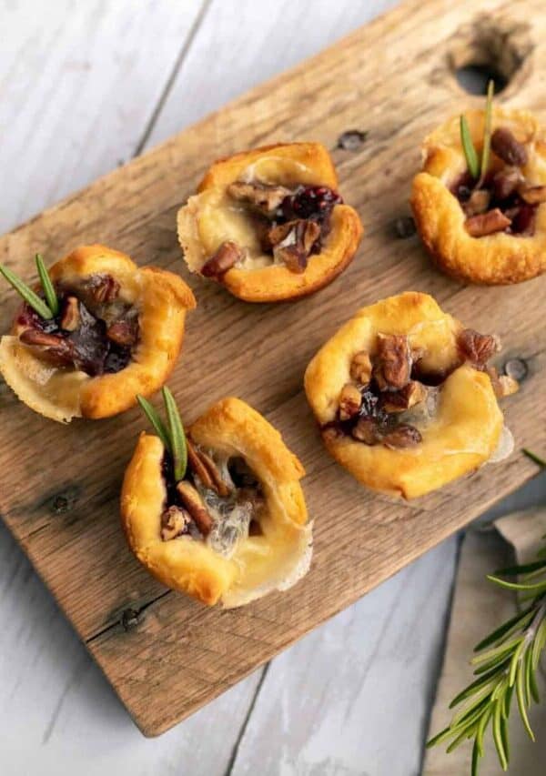 Overhead image of Cranberry Brie Bites on a wooden cutting board