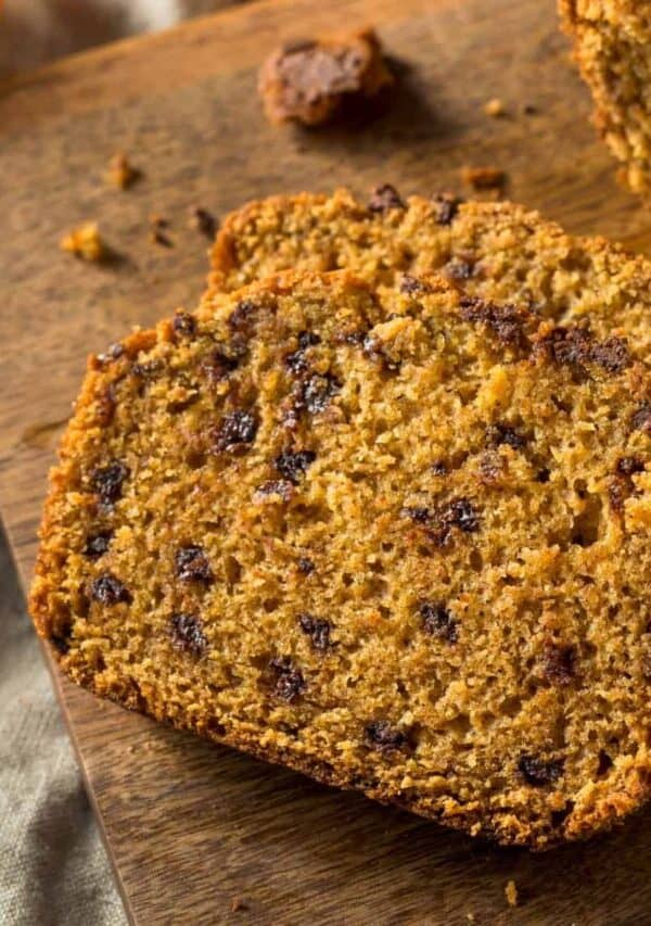 Sliced Pumpkin Chocolate Chip Bread on a wooden cutting board