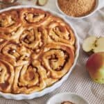 Close up image of Apple Cinnamon Rolls in a white baking dish - 8