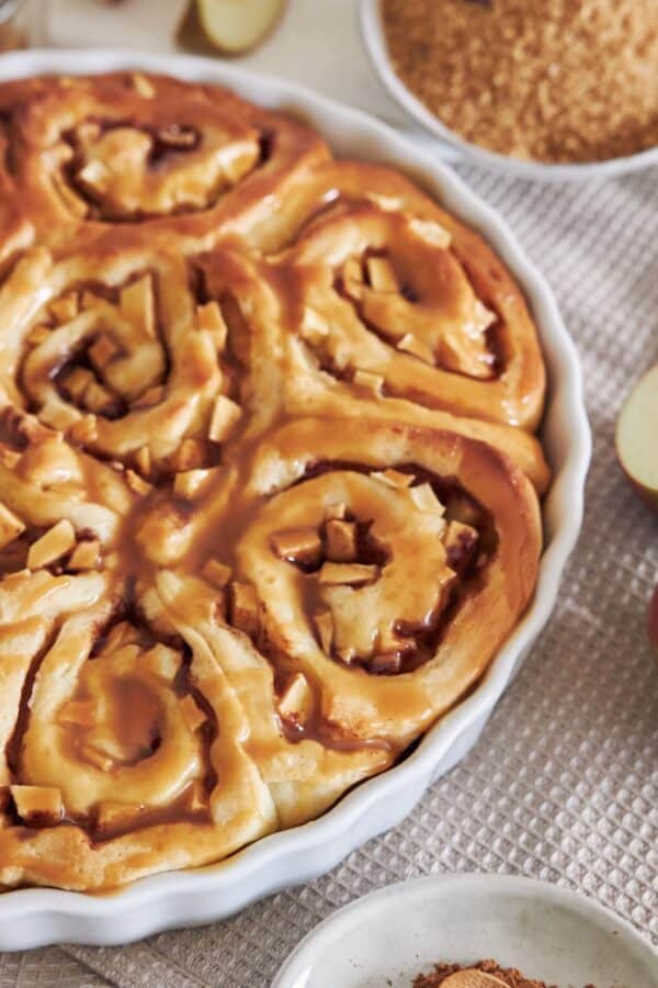 Close up image of Apple Cinnamon Rolls in a white baking dish