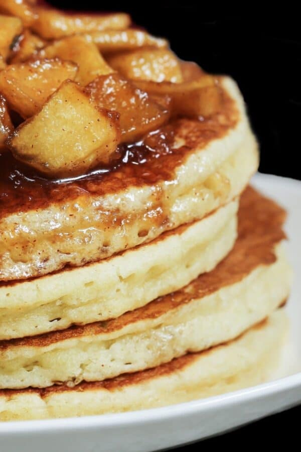 A stack of apple pie pancakes on a plate