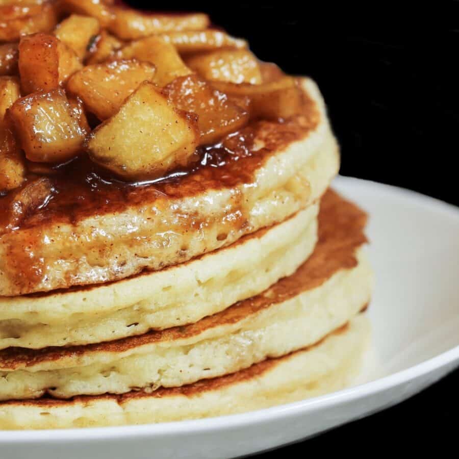 A stack of apple pie pancakes on a plate